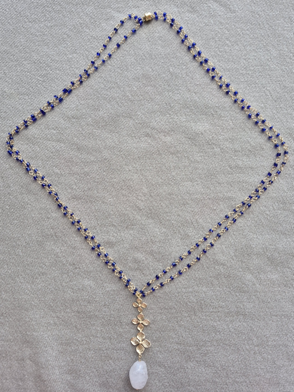 Delicate Gold Floral Pendant Necklace with Blue Beads